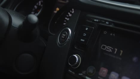 Close-up-Hand-turning-on-the-car-engine-button