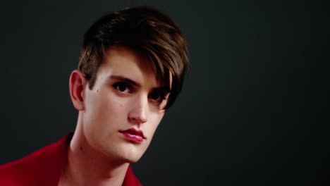 androgynous man wrapped in red clothes