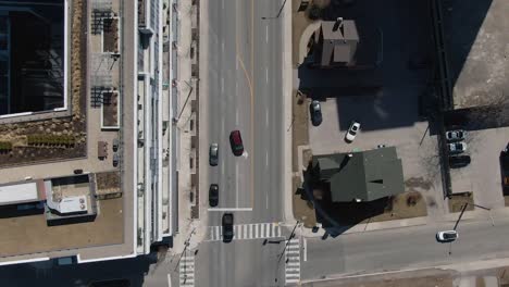 top-down aerial view of an intersection of apartments with cars in mississauga