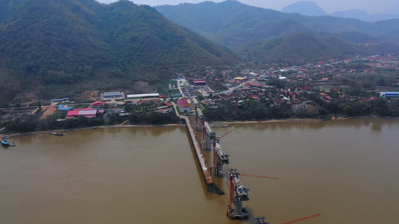 Bridge Construction Over River in Mountainous Region