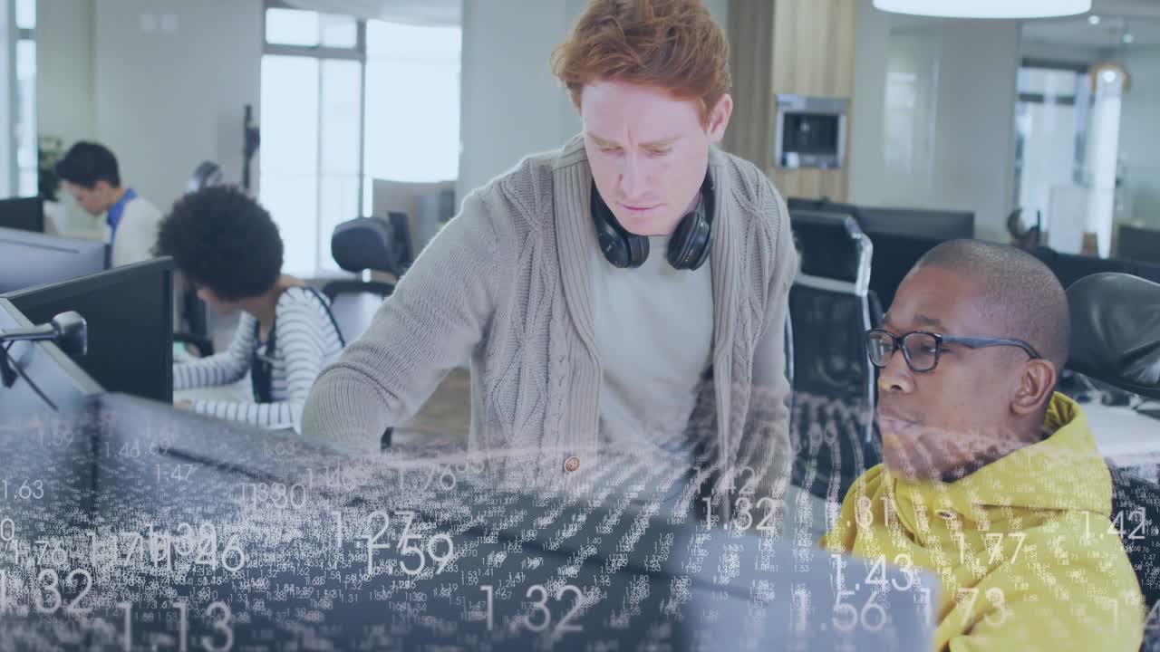 Standing dev pointing at monitor causing numeric overlay scrolling while seated peer analyzing data