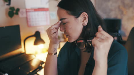 a young businesswoman suffering from a headache