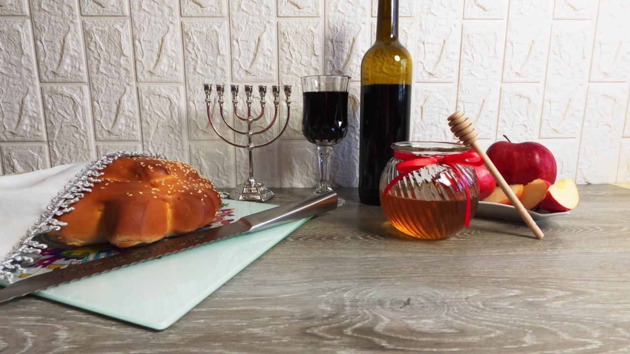 Rosh hashanah celebration with challah, honey, and wine