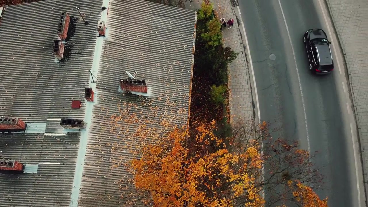 Aerial view of a drone flying over the residential buildings, roof shooting and architecture.