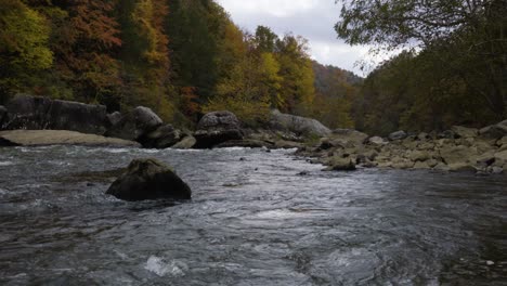 Low-angle-shot-of-water-flowing-down-through-the-river-Gorge,-West-Virginia