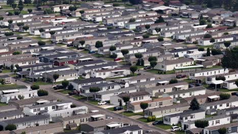 Overhead aerial of neighborhood streets in Indiana with lush green lawns and clean streets