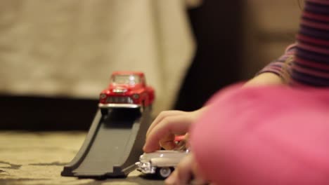 child kid plays with a toy cars