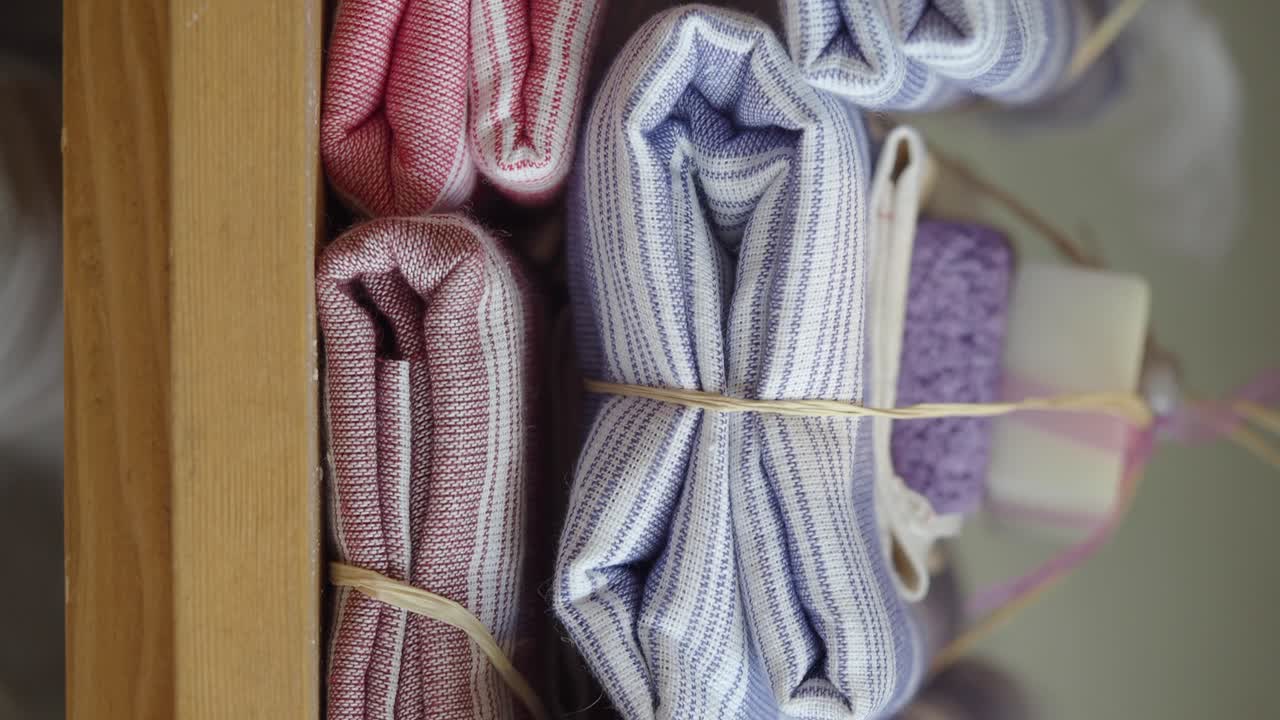 Neatly Rolled Striped Towels and Bath Accessories