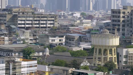 panoramic close up shot over bangkok skyline with gritty buildings and skyscrapers