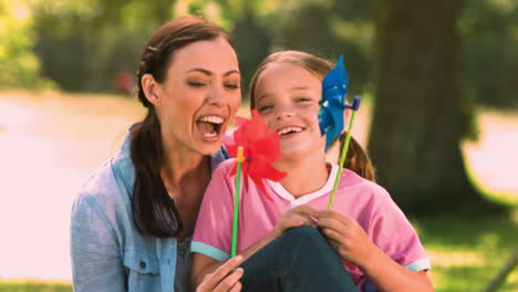 Woman-in-slow-motion-blowing-on-a-pinwheel