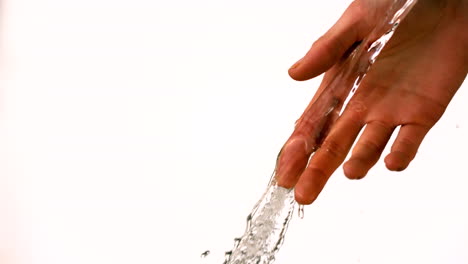 Water-pouring-over-female-hand