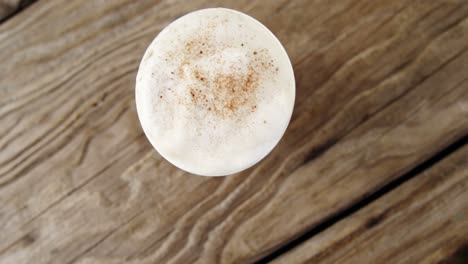 coffee cup on wooden plank