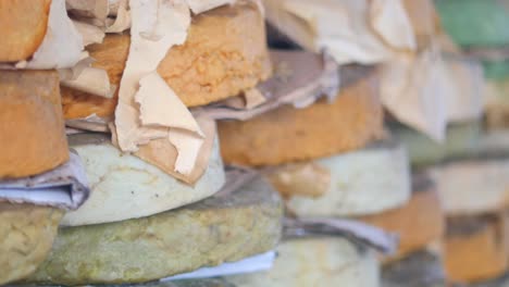 stacked cheese at a market