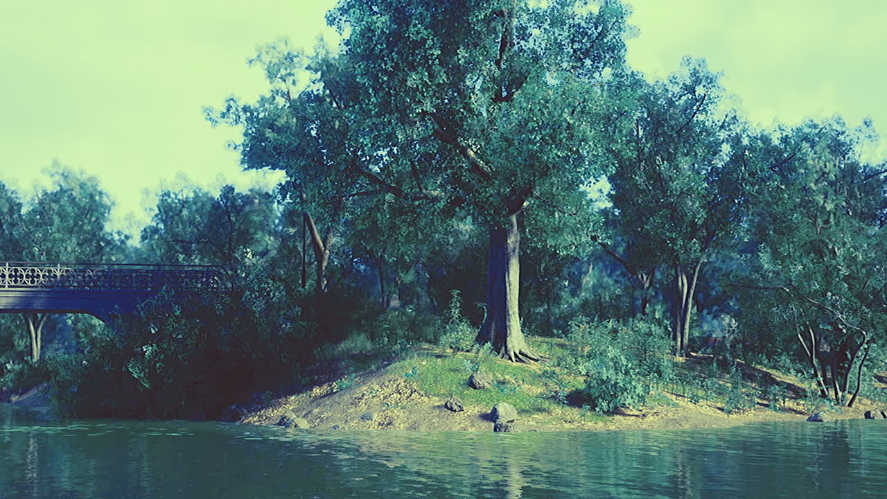 Serene riverside landscape with lush greenery and a charming bridge near water