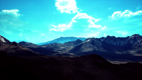 majestic mountain range under a vivid blue sky