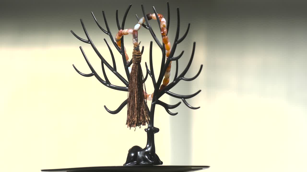 Red and white gems Rosary on turntable fast motion