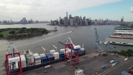 new york city skyline with industrial shipping yard in foreground