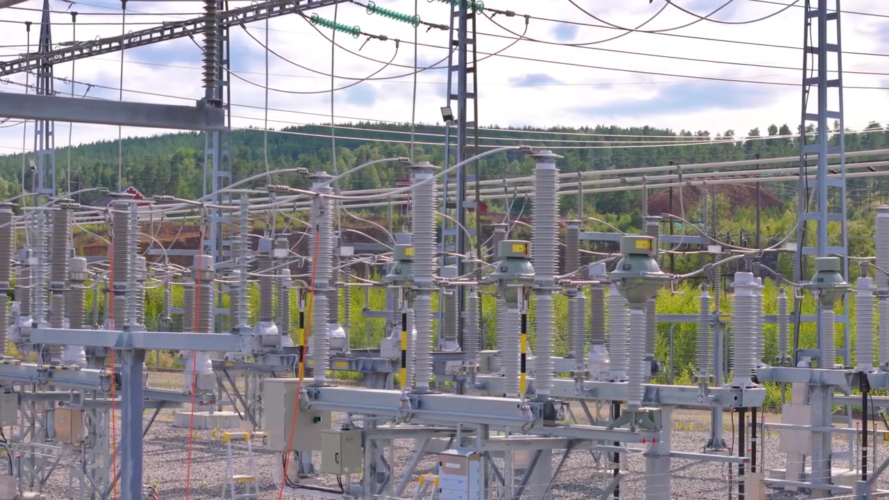 Drone view of electricity substation with distribution lines and infrastructure