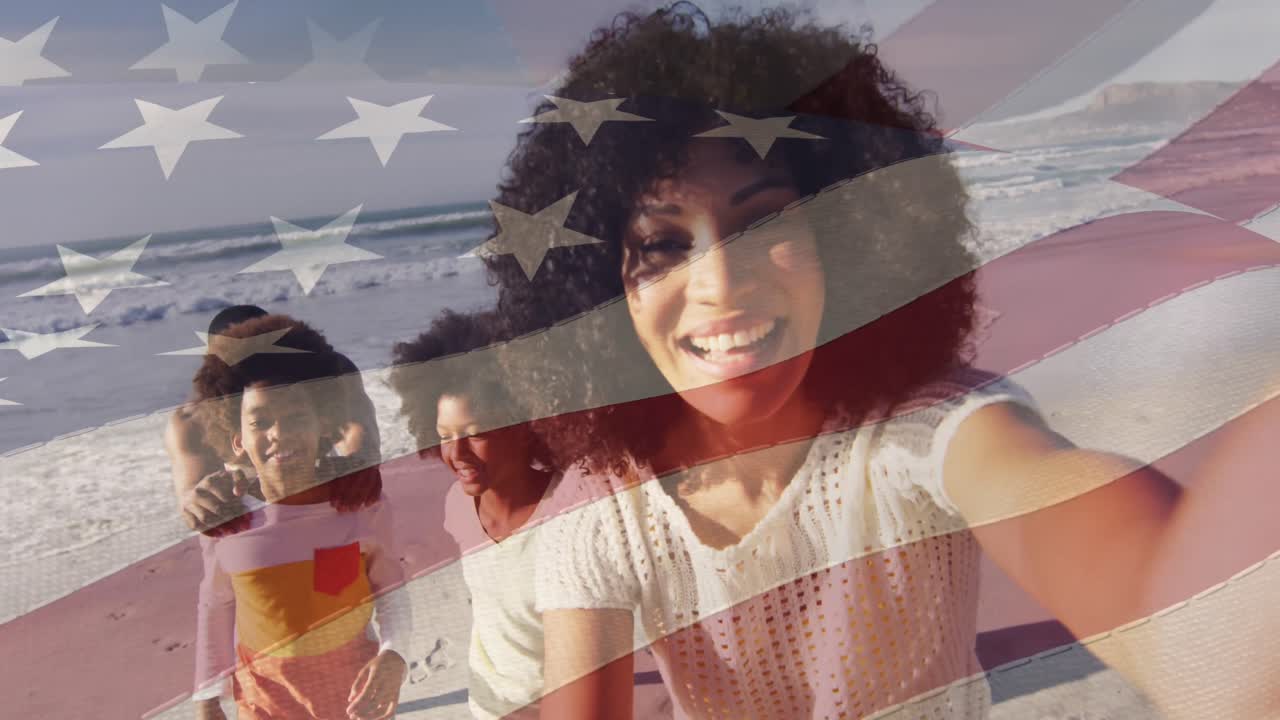 animación de la bandera de estados unidos sobre una feliz pareja afroamericana con niños en la playa