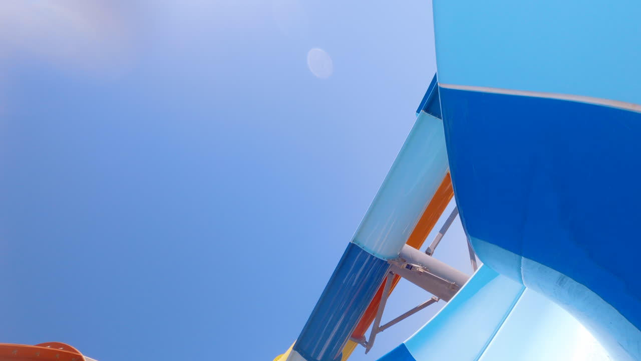 Woman sliding down a ride at a water park