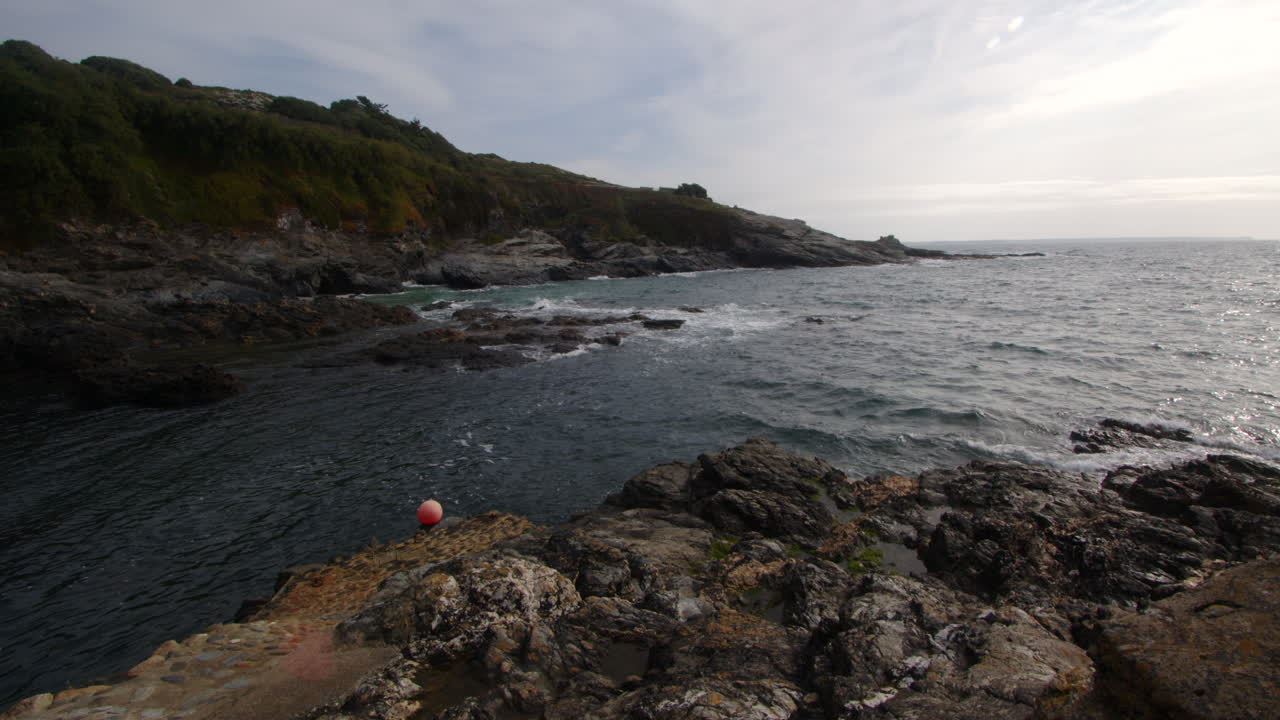 Extra Wide shot of the sea and rocks at Bessy's Cove, The Enys, cornwall
