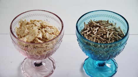 copos de trigo y palitos de salvado de cereales en el cuenco 4k