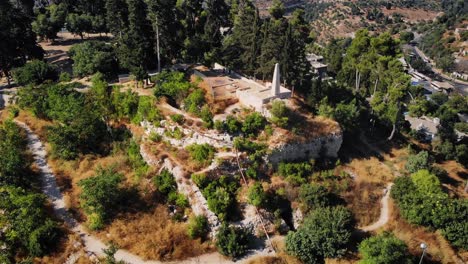 aerial view of ancient ruins and monument on a hilltop