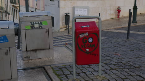 Metal-Bins-for-Waste-Segregation-in-Lisbon,-Portugal-Wide-Shot