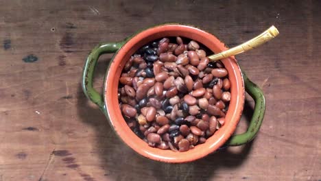 overhead steaming bowl of cooked multi color cooked beans