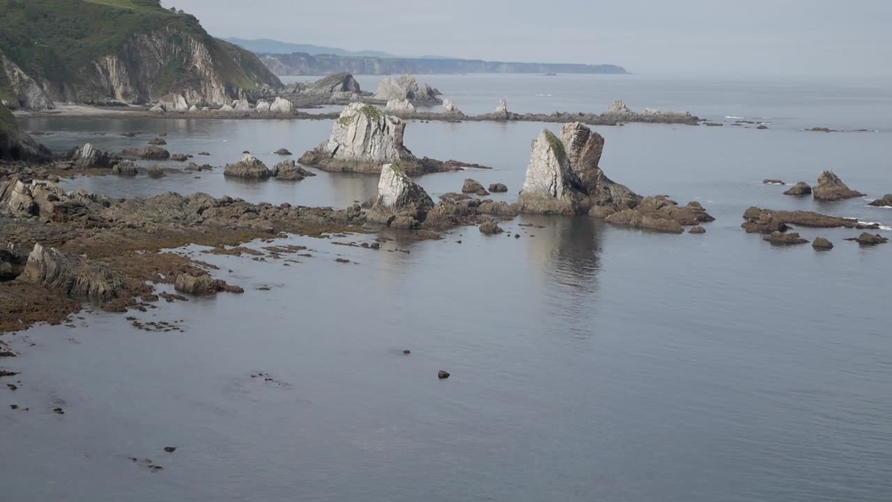 Rocky coastal view at Silence Beach, Asturias, evoking calm, stillness and raw nature