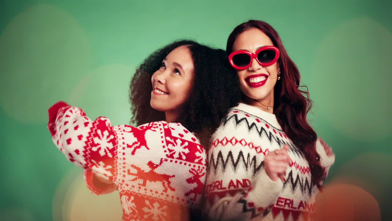 Two Women Celebrating the Holidays in Christmas Sweaters