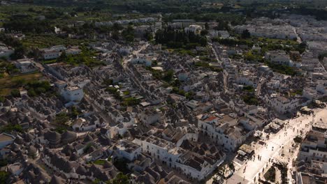drone view of alberobello trulli rooftops and narrow alleys. round trullo shepherd huts, apulia, italy