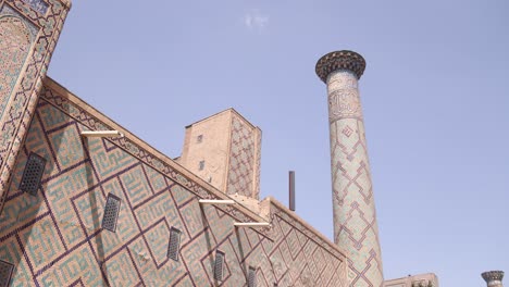 detailed tiling on minaret and wall of mosque in samarkand, uzbekistan along the historic silk road