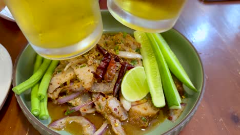 delicious thai pork dish with refreshing beverage