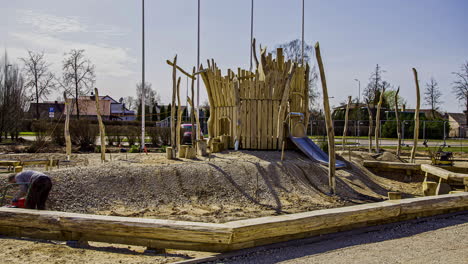 fusion time lapse of workers building playground in small town