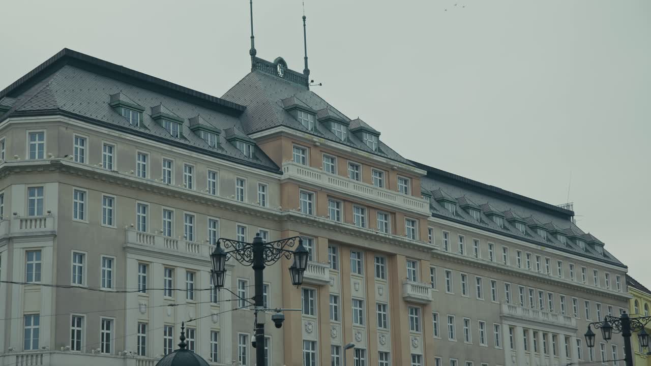Classic European style building in Bratislava with ornate windows and rooftop details