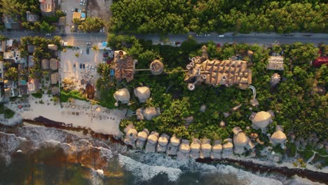rising aerial view of the azulik resort in quintana roo, mexico
