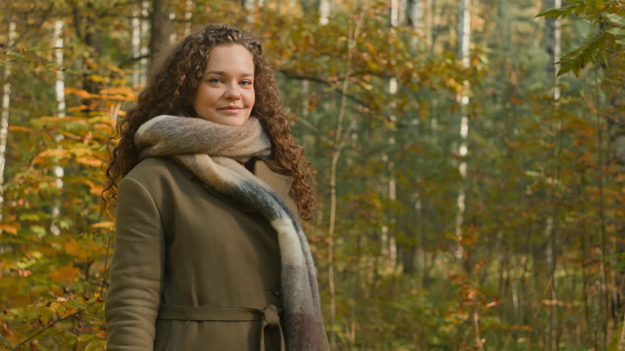 Woman walking in a forest during autumn