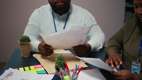 close up of diverse staff collaborating on data forecasting and analysis