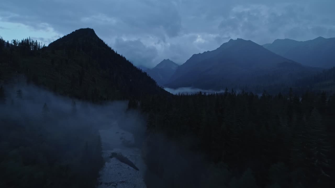 Aerial forward mountain evening landscape shrouded in fog. Jaworzyna, Slovakia