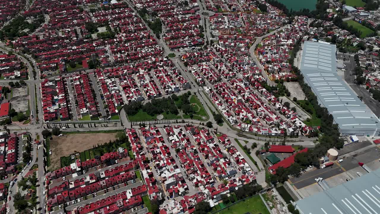 Aerial drone shot of a residential neighborhood near the industrial park in the municipality of Cuautitlán Izcalli, part of the metropolitan area of Mexico City