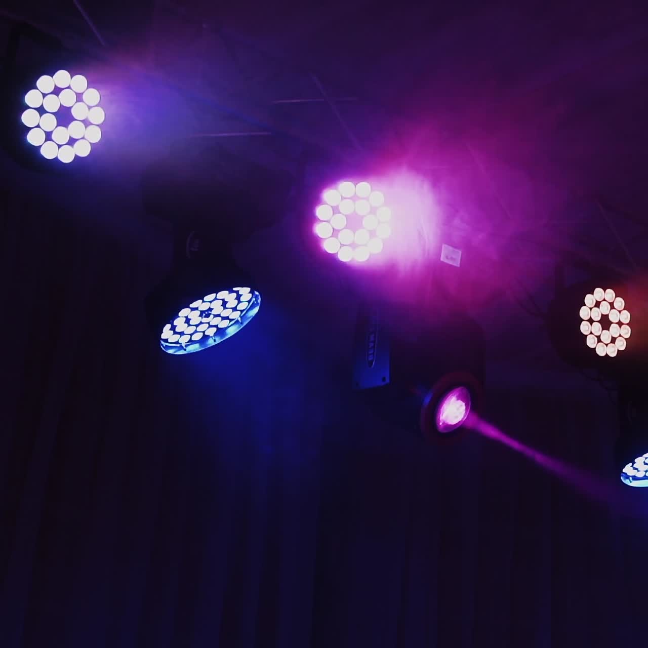 Stage light rack with colorful spotlights. Musical farm with lasers rotating and shining down in the concert hall.