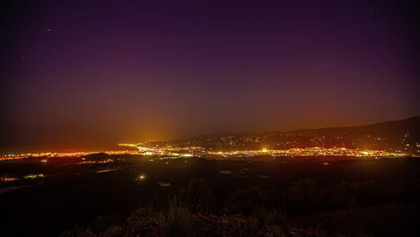 Lapso-De-Tiempo-De-Transición-De-Noche-A-Día-Con-Vistas-A-La-Hermosa-Ciudad-Costera-De-Málaga-Y-Al-Mar-Mediterráneo