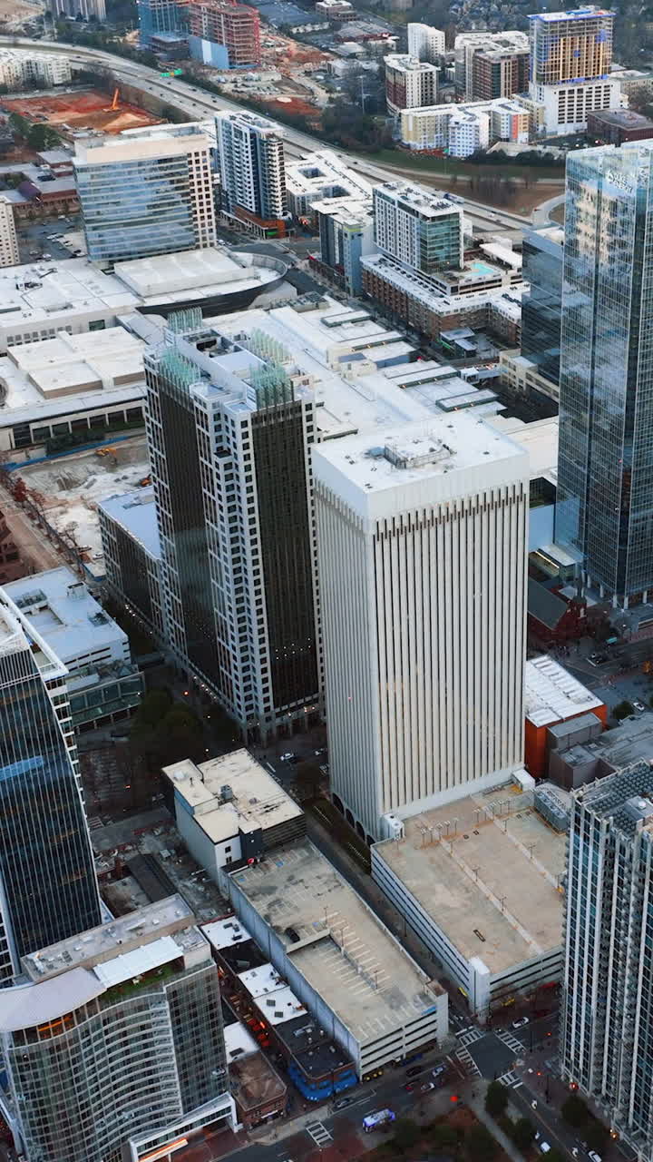 Charlotte, North Carolina, USA - January 05, 2024: Winter aerial view of downtown Charlotte with streets and skyscrapers. Vertical video