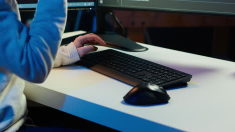 teleworking computer technician typing on keyboard, close up