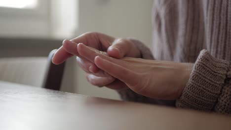 Female-touches-her-hands-and-checking-skin-hydration