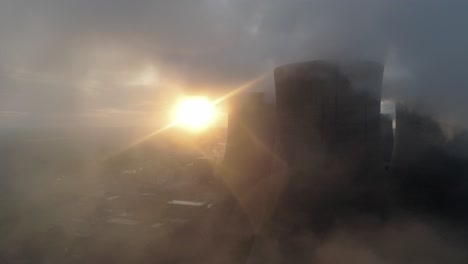 Aerial-view-of-UK-power-station-cooling-towers-smoke-steam-emissions