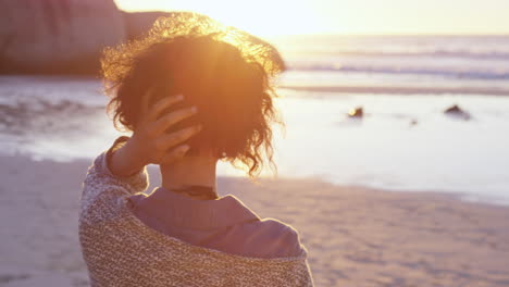 portrait of beautiful girl on beach at sunset in slow motion