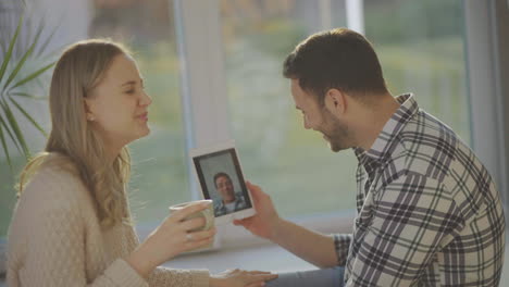 couple having video call with friend