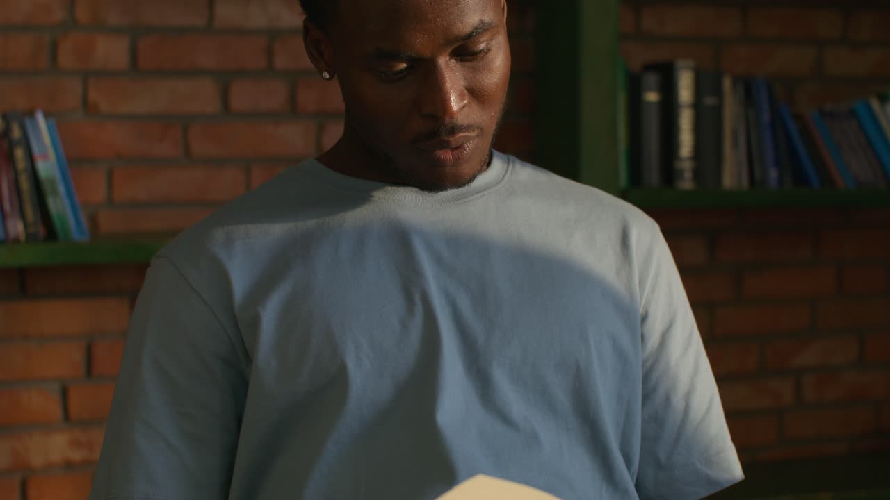 Man Reading in a Library